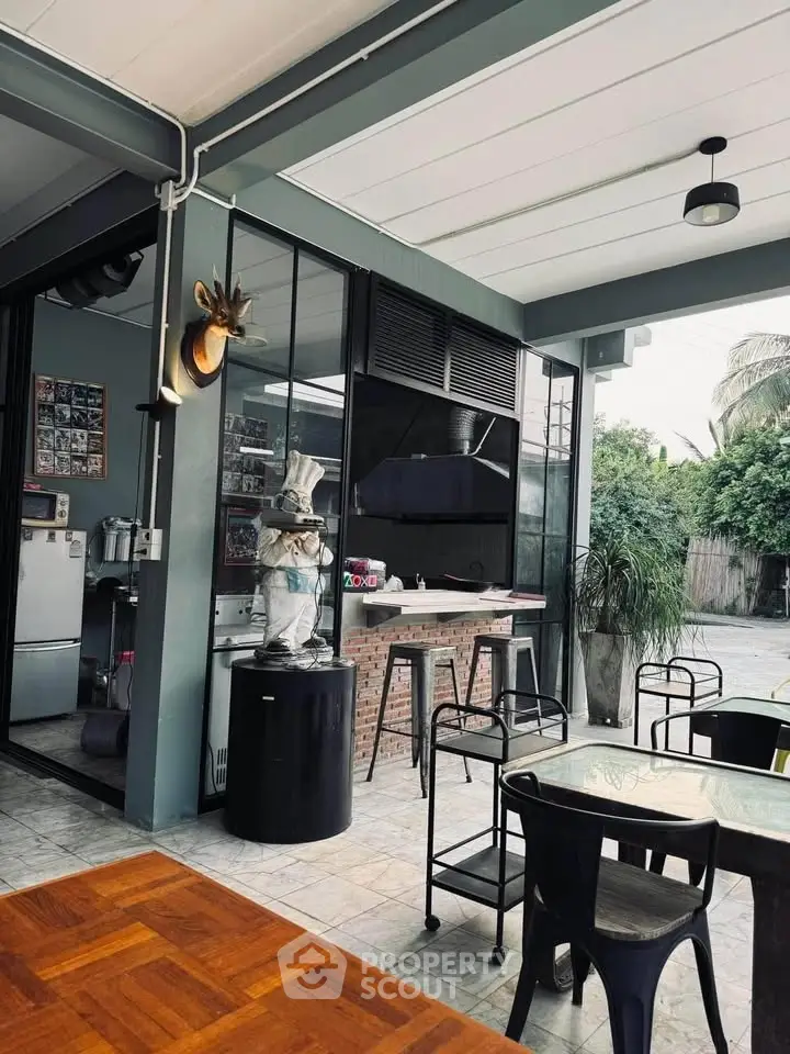 Chic outdoor dining area with modern decor and stylish furniture, perfect for entertaining guests.