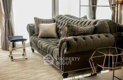 Luxurious living room with elegant tufted sofa and stylish decor