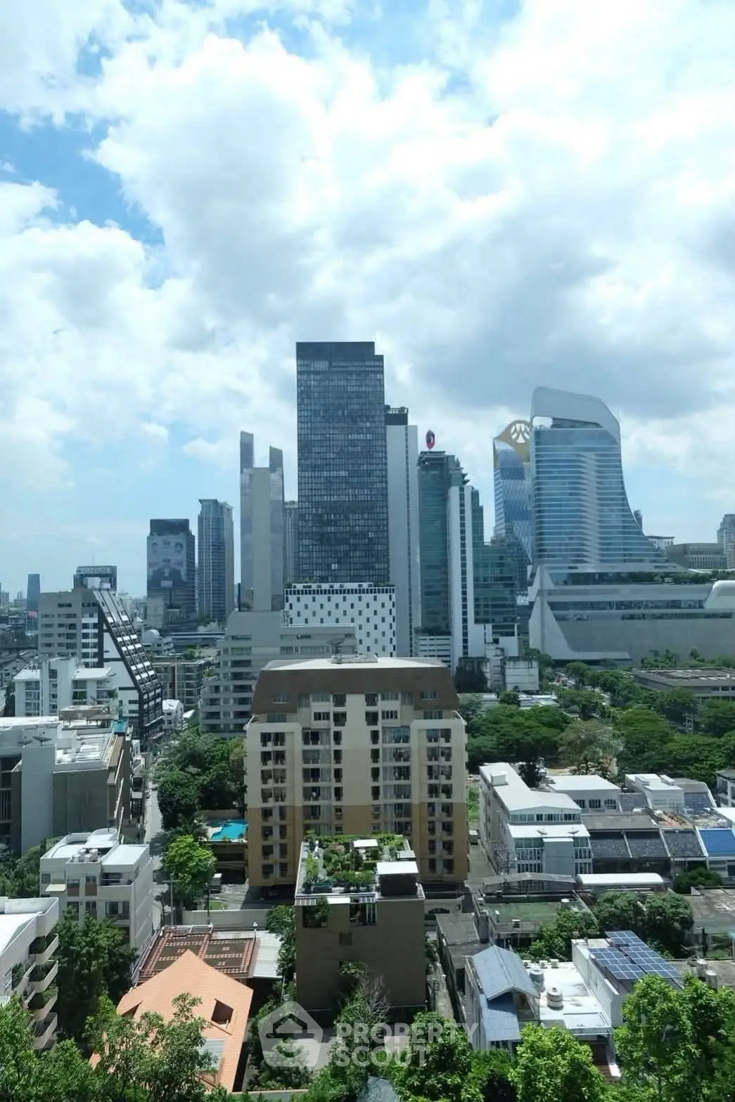 Stunning cityscape view showcasing modern skyscrapers and lush greenery, perfect for urban living enthusiasts.