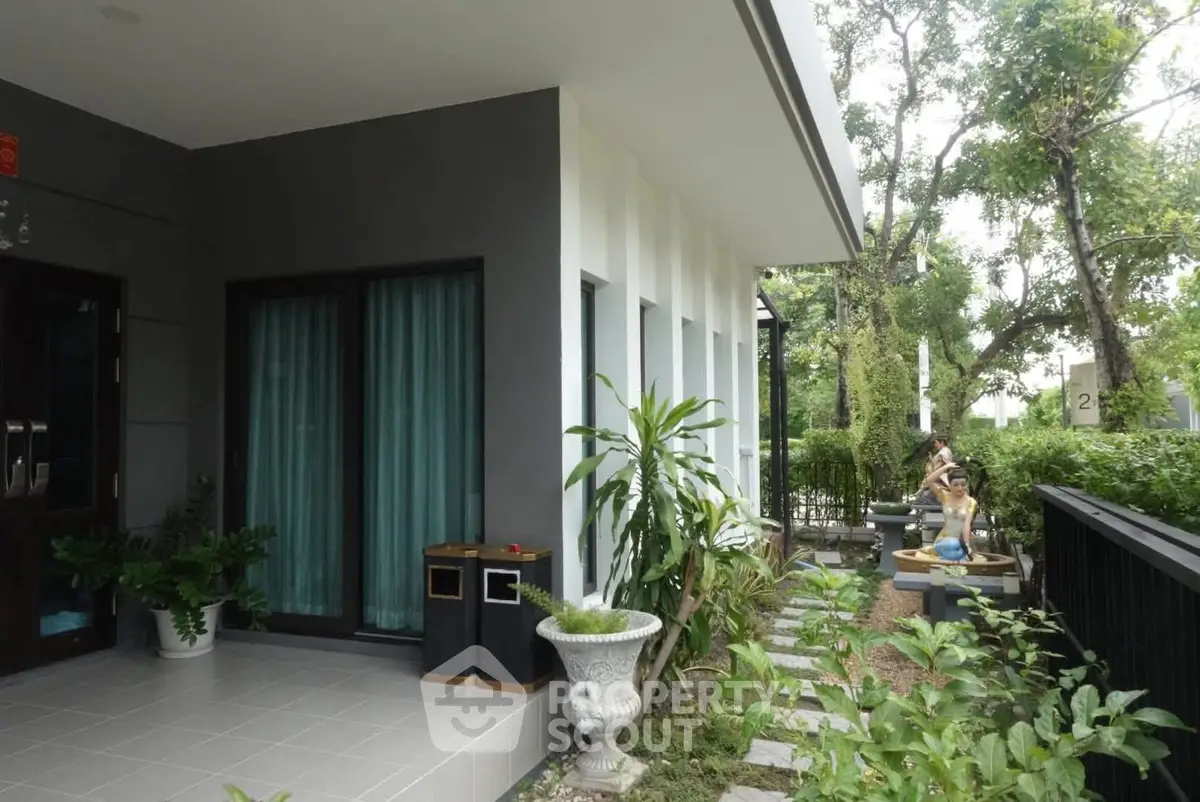 Charming modern home exterior with lush garden and stylish design