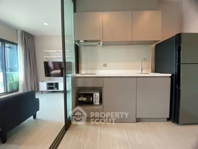 Modern open-layout kitchen with sleek cabinets and appliances