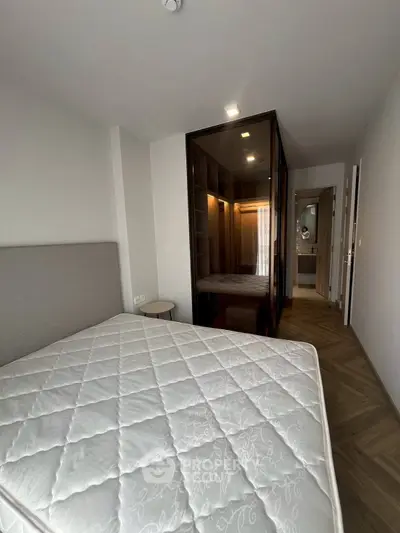 Modern bedroom with stylish wardrobe and cozy lighting