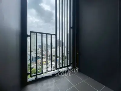 Modern balcony with city skyline view and sleek railing design.