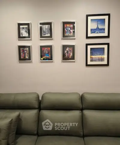 Stylish living room with modern art gallery wall and comfortable sofa