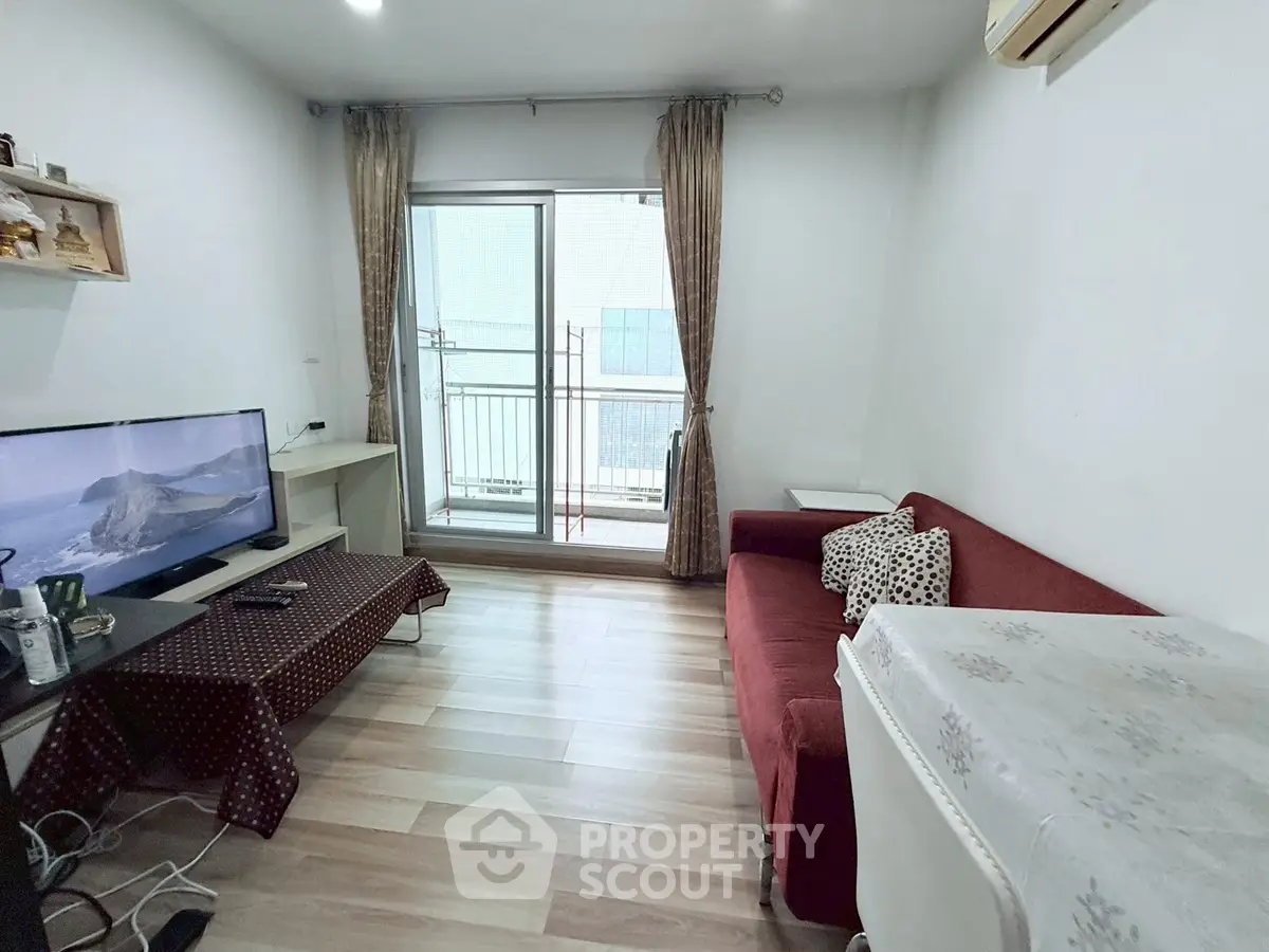 Cozy living room with balcony access and modern decor