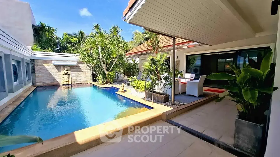 Luxurious villa with private pool and tropical garden, perfect for relaxation and entertainment.