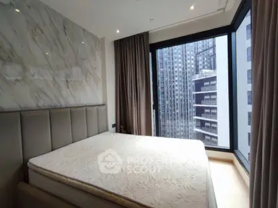 Luxurious bedroom with floor-to-ceiling windows offering stunning city views in a modern high-rise apartment.