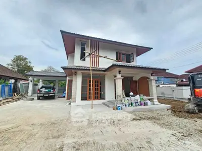 Modern two-story house with spacious driveway and contemporary design.