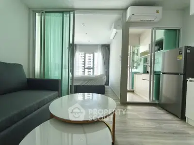 Modern apartment interior with open layout, featuring a cozy living room, sleek kitchen, and bright bedroom.