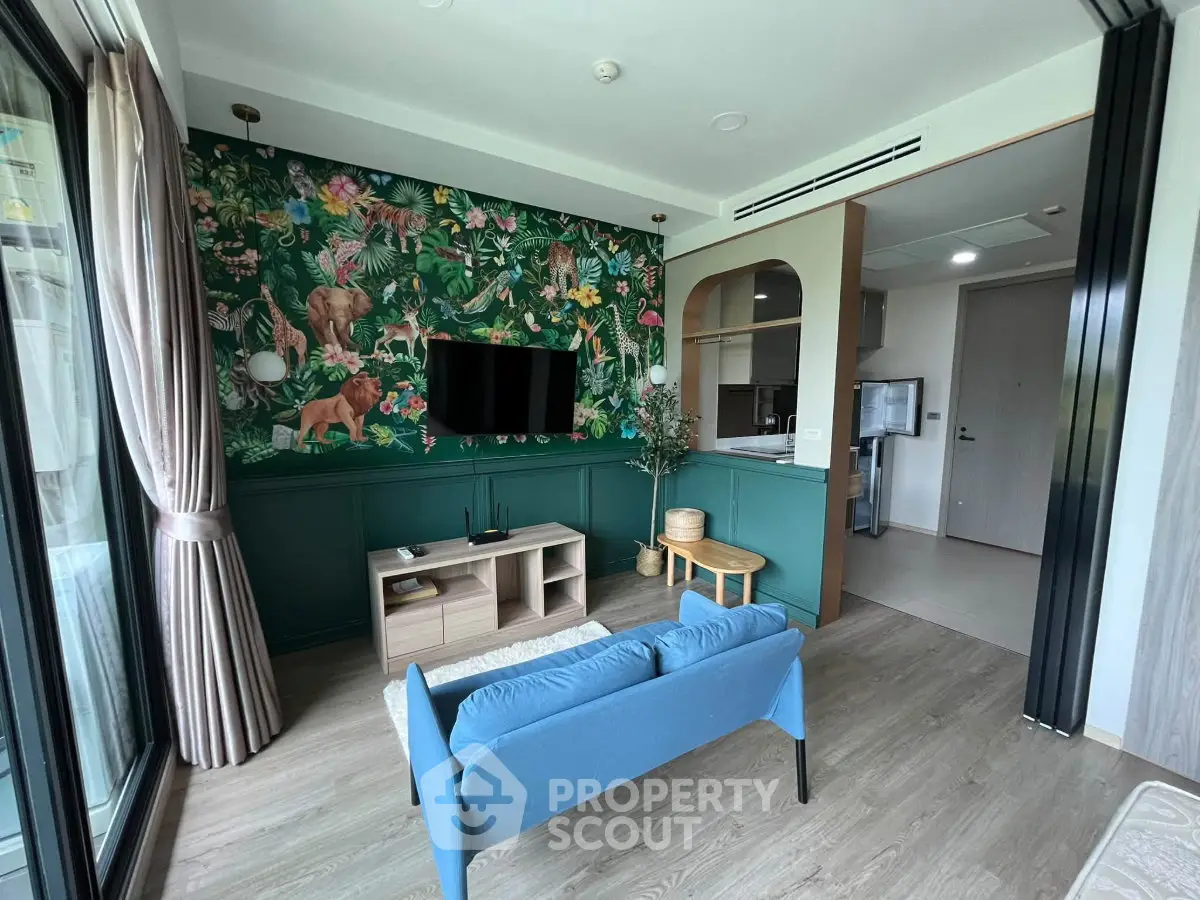 Stylish living room with vibrant jungle-themed wallpaper and modern furnishings