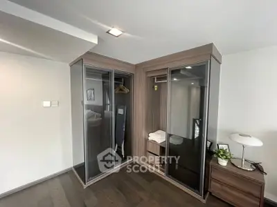 Modern bedroom with sleek built-in wardrobe and stylish decor