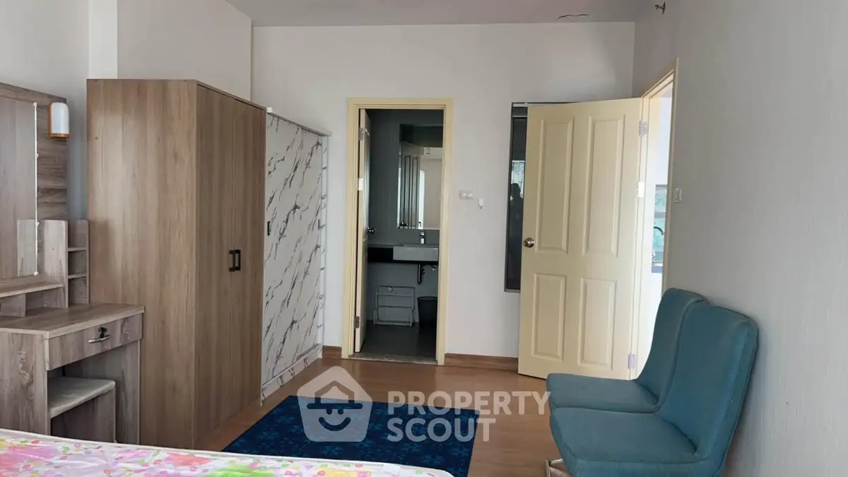 Spacious bedroom with modern furniture and ensuite bathroom