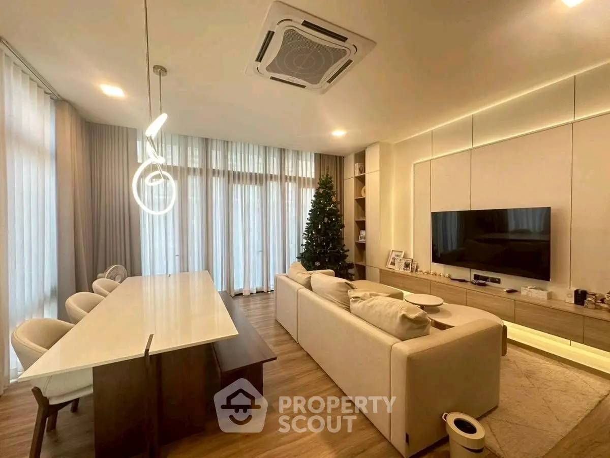 Modern living room with elegant dining area and stylish lighting