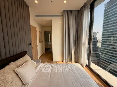 Luxurious corner bedroom with floor-to-ceiling windows offering stunning city views in a modern high-rise apartment.