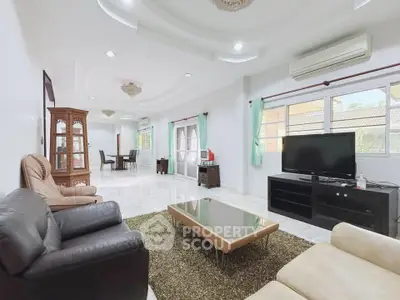 Spacious living room with modern decor and ample natural light