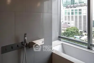 Modern bathroom with city view, featuring sleek design and large window for natural light.