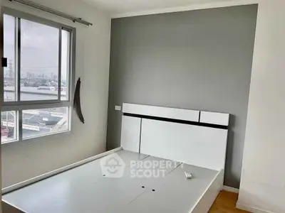 Modern bedroom with sleek design and city view window