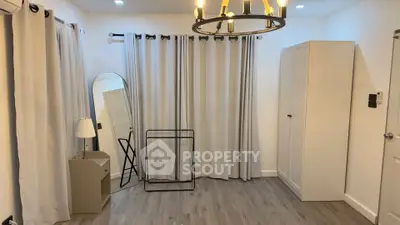 Spacious room with modern decor and ample natural light