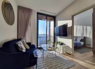 Modern living room with balcony view and stylish decor in urban apartment
