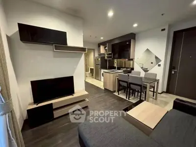 Modern living room with sleek furniture and open kitchen layout