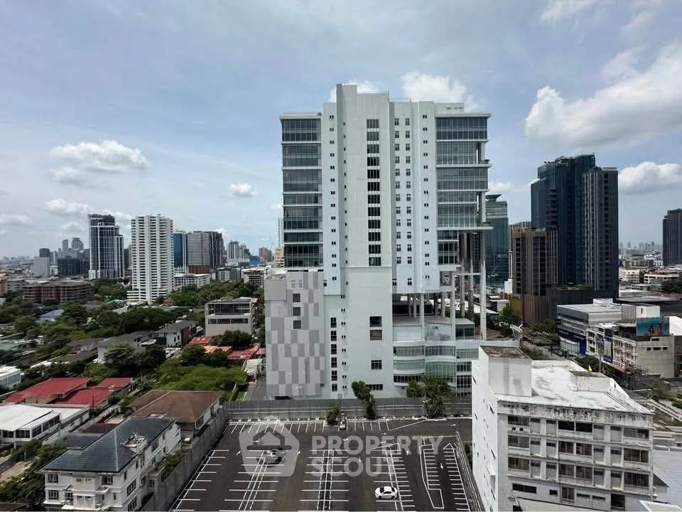 Stunning high-rise building with panoramic city views and ample parking space.