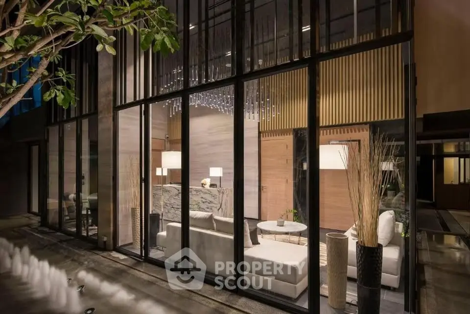 Luxurious modern living room with floor-to-ceiling windows and elegant decor.