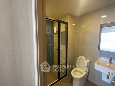 Modern bathroom with glass shower and sleek fixtures