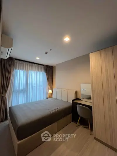 Modern bedroom with cozy lighting and stylish furniture in a contemporary apartment.