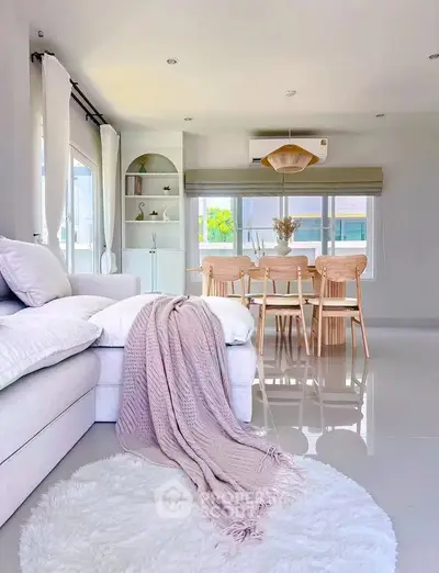 Spacious modern living room with elegant dining area and natural light