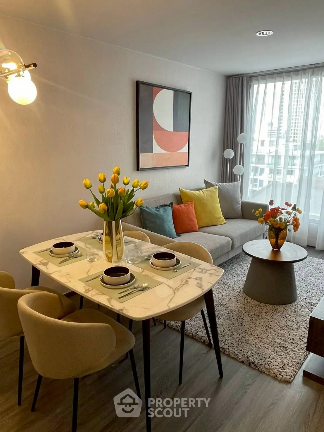 Stylish living room with modern decor and city view, perfect for urban living.