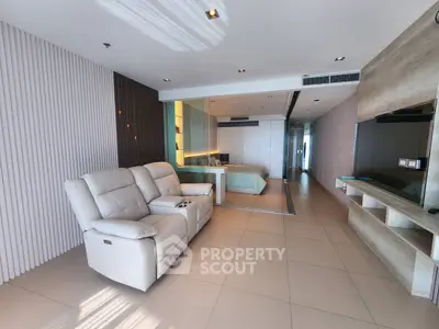 Modern open-plan living room with sleek design and cozy seating