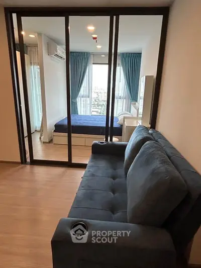 Modern apartment with glass partitioned bedroom and cozy living area
