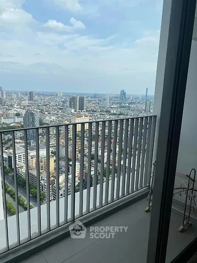 Stunning high-rise balcony with panoramic city views, perfect for urban living enthusiasts.