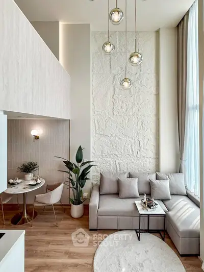 Modern living room with high ceiling and elegant decor