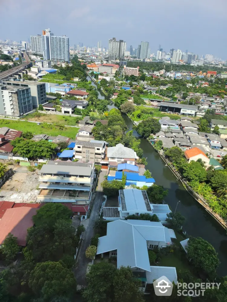 Stunning aerial view of urban landscape with river and modern buildings