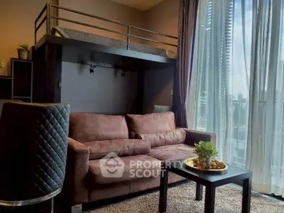Modern living room with loft bed and city view through large windows.