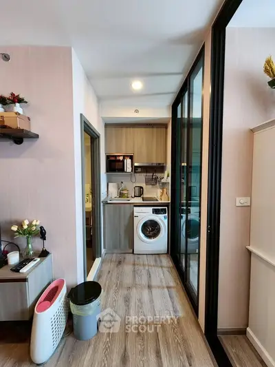 Modern compact kitchen with washing machine and sleek design