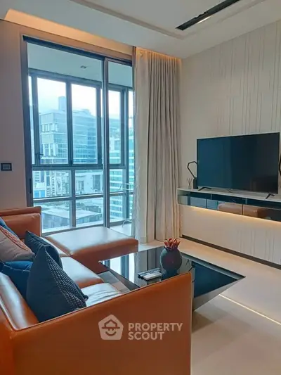 Luxurious modern living room with large windows and city view, featuring sleek furniture and a mounted TV.