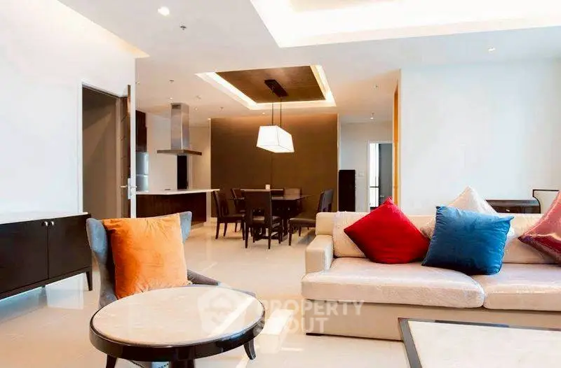 Spacious modern living room with open kitchen and stylish decor