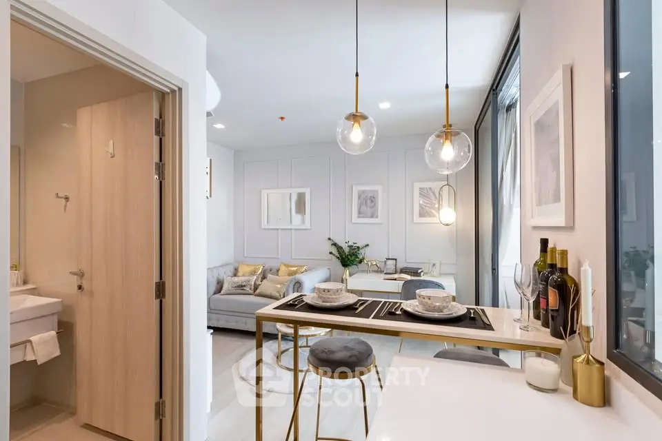 Modern open-plan living room and dining area with stylish decor and elegant lighting.