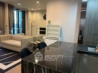 Modern living room with marble countertop and mirrored wall