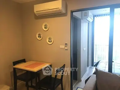Cozy apartment interior with dining area and balcony view