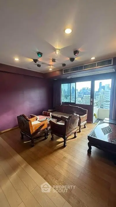 Spacious living room with elegant wooden furniture and city view, perfect for urban living.