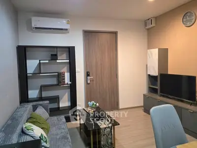 Modern living room with sleek furniture and air conditioning, perfect for comfortable urban living.