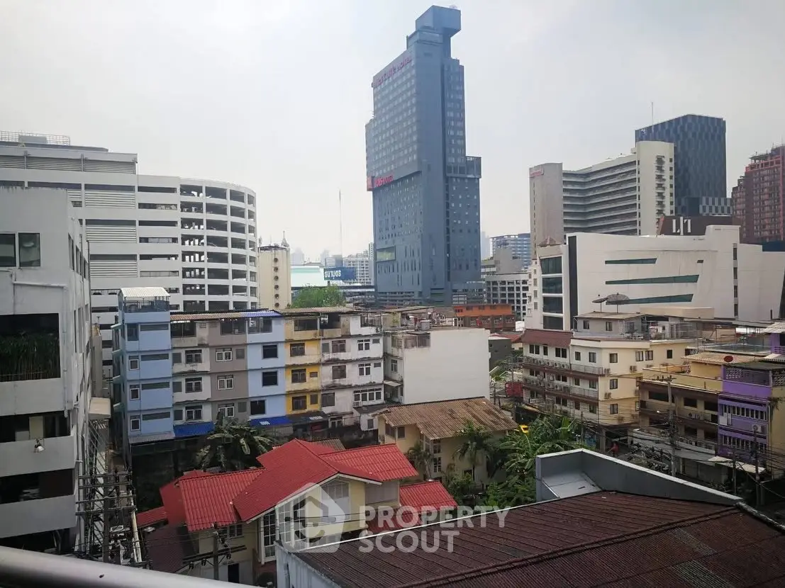 Urban cityscape view with diverse architecture and high-rise buildings.