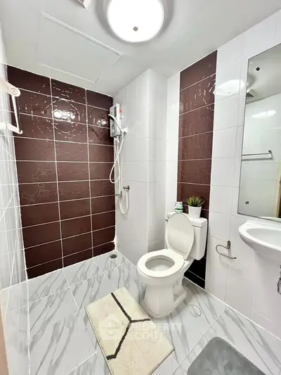Modern bathroom with sleek tiles and contemporary fixtures