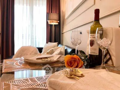 Elegant dining setup with wine and decor in a stylish living room