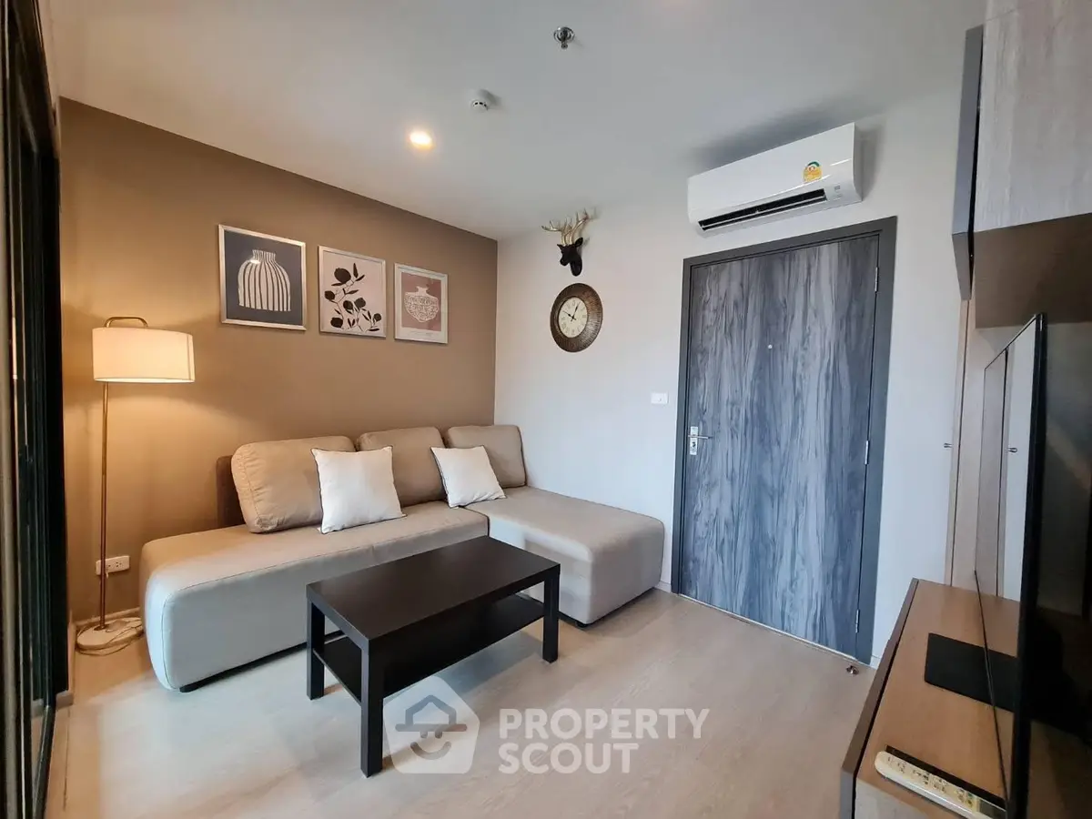 Modern living room with stylish decor and comfortable seating in a contemporary apartment.