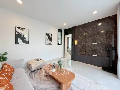 Modern living room with stylish decor and elegant marble accent wall