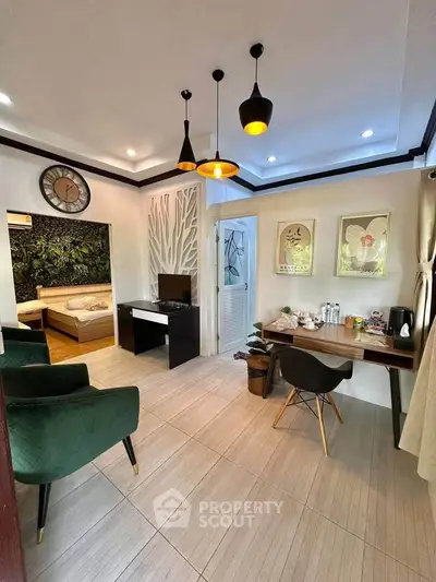 Chic modern living room with stylish decor and cozy bedroom view, perfect for urban living.